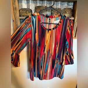 Colorfully beautiful blouse with 3/4. bell sleeves.